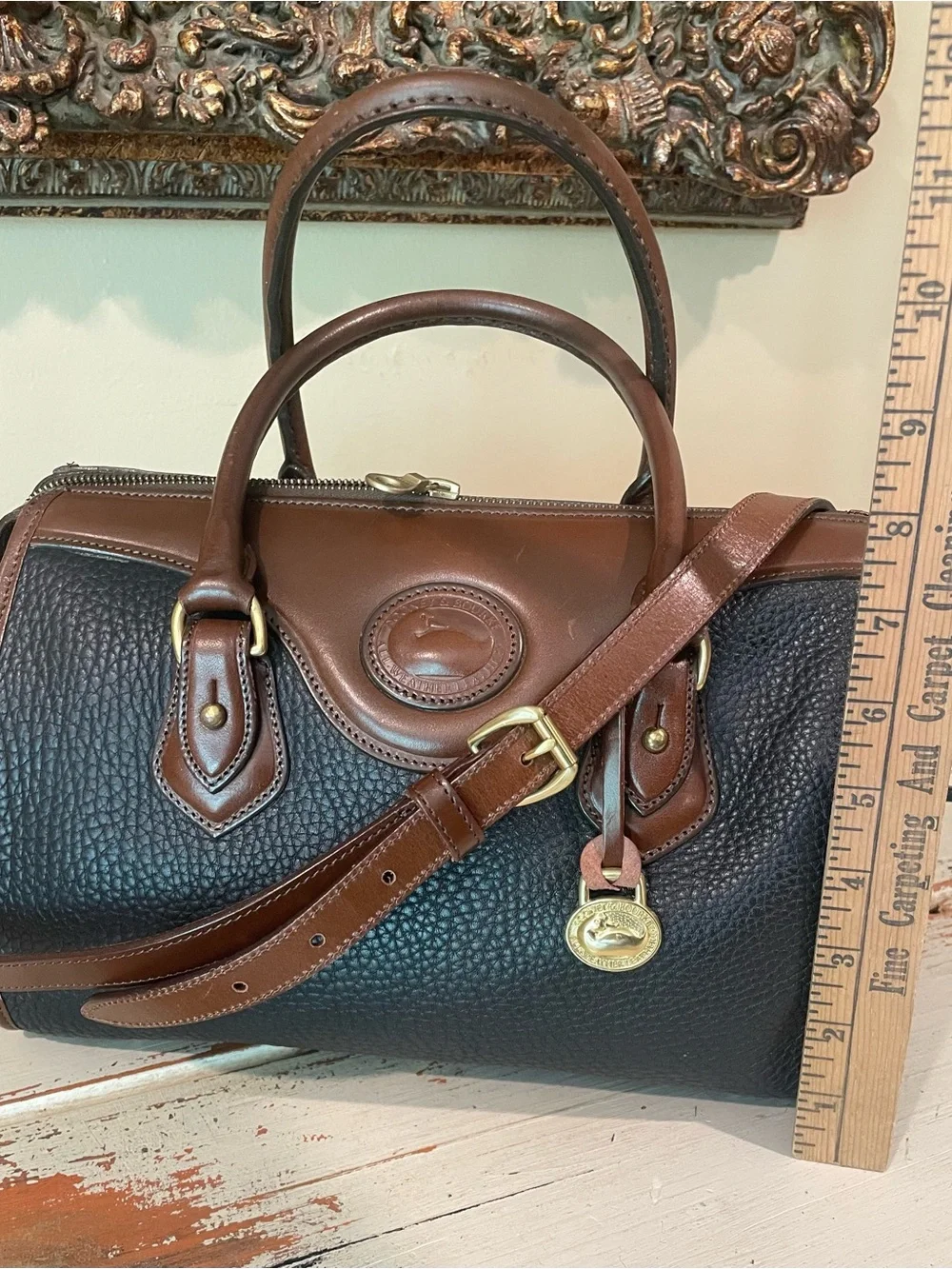 Dooney & Bourke vintage AWL Black and Brown Pebbled Leather Satchel / crossbody